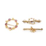 An Edwardian garnet and seed pearl set wreath brooch, the pink stones alternating with seed pearl