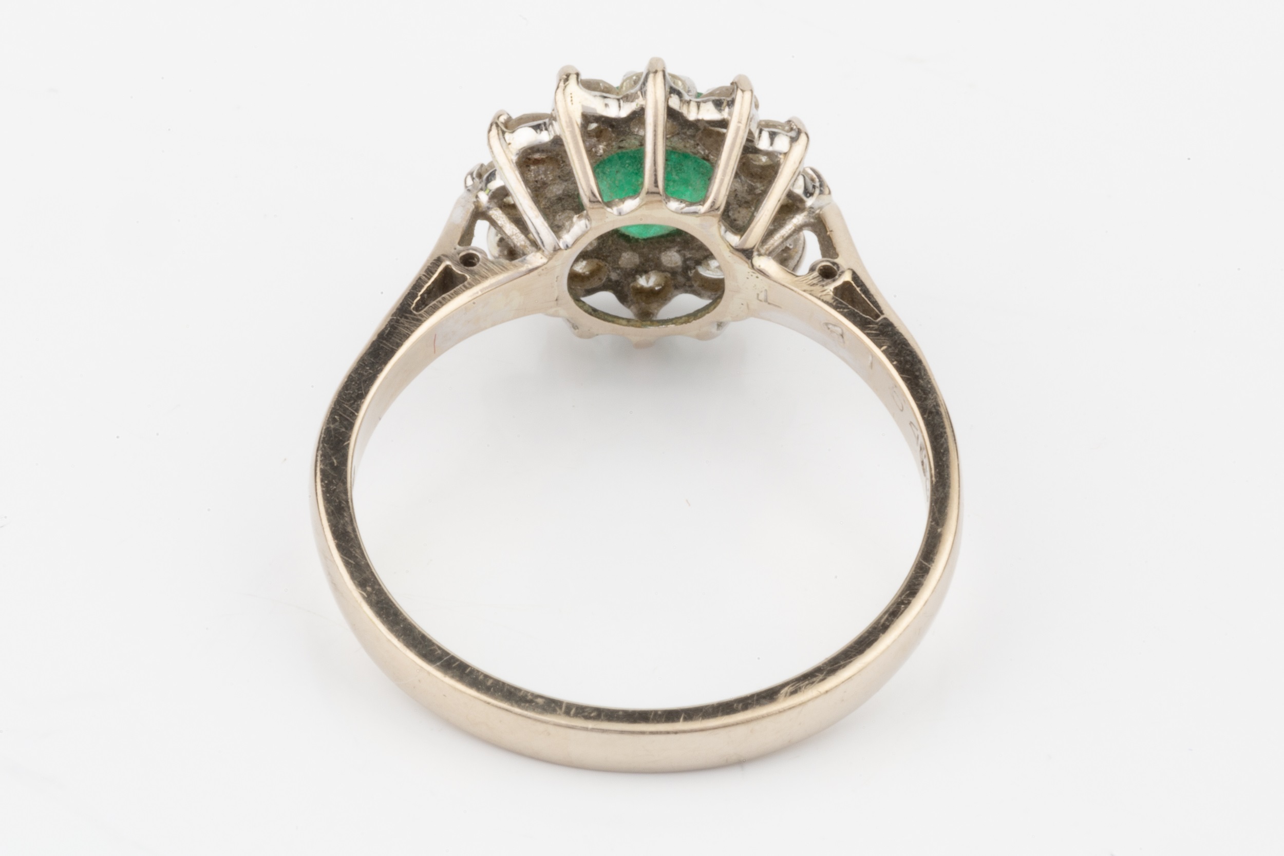 An emerald and diamond cluster ring, the central circular emerald within a border of twelve - Image 3 of 3