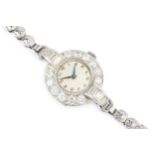 A diamond cocktail watch, the circular bezel set with twelve round brilliant cut diamonds, and