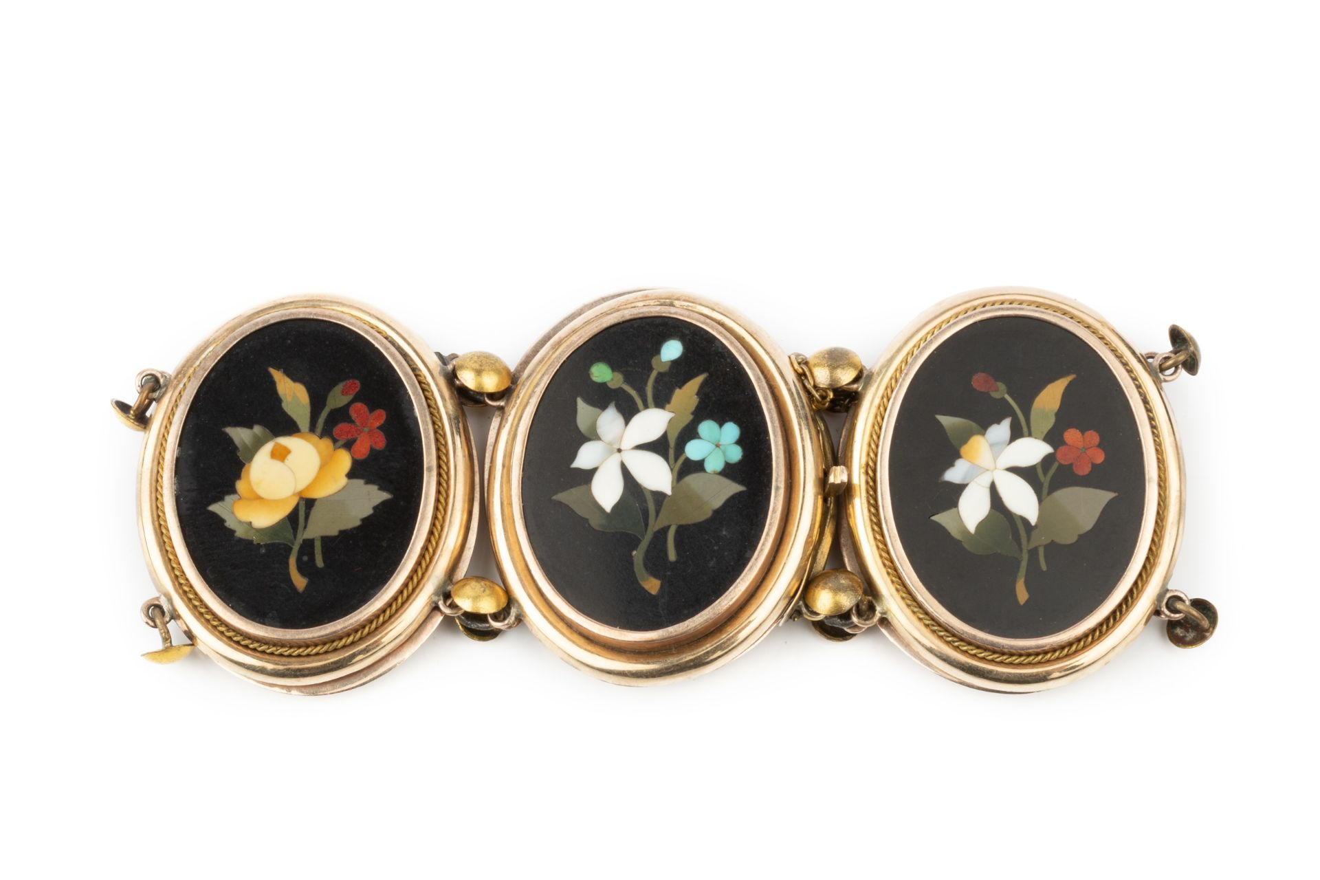 A pietra dura bracelet, the six oval panels inlaid with specimen floral sprays on a black ground,