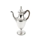 A George III silver coffee pot, of classical urn form, with beaded borders, hinged cover and