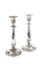 A pair of early 19th century Italian silver candlesticks, having gadrooned borders, the knopped