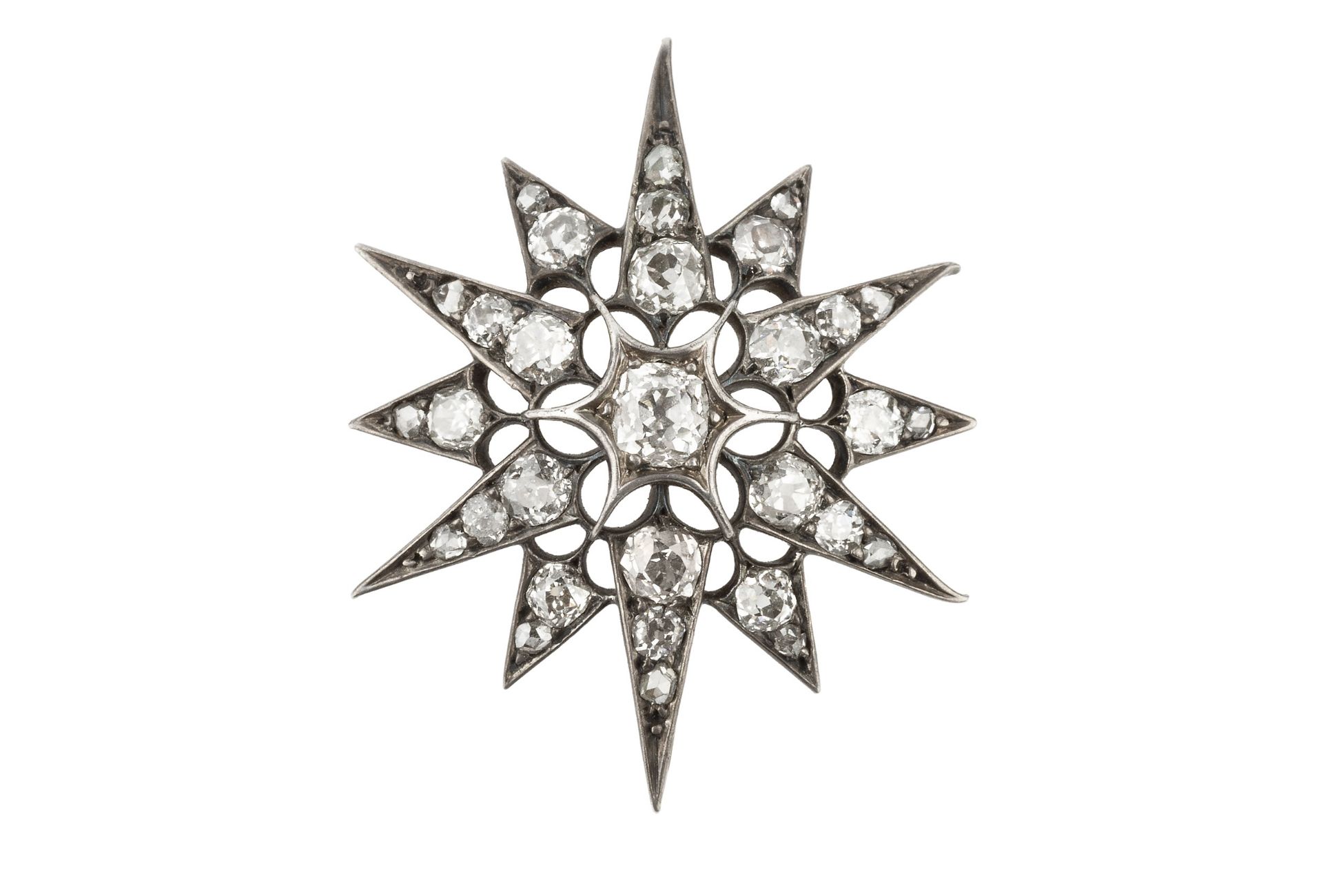 A late Victorian/Edwardian diamond star brooch/pendant, set throughout with graduated old-cut