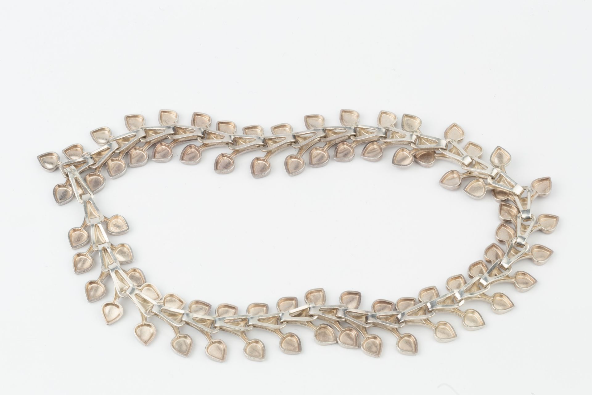 A Swedish silver choker necklace, composed of interlocking stylised twin leaf motif links, maker's - Image 2 of 2