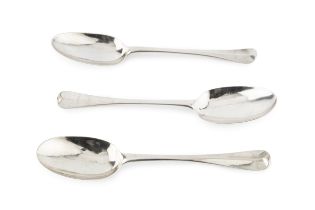 A Queen Anne silver Hanoverian pattern tablespoon, maker's mark indistinct, London 1710, and two