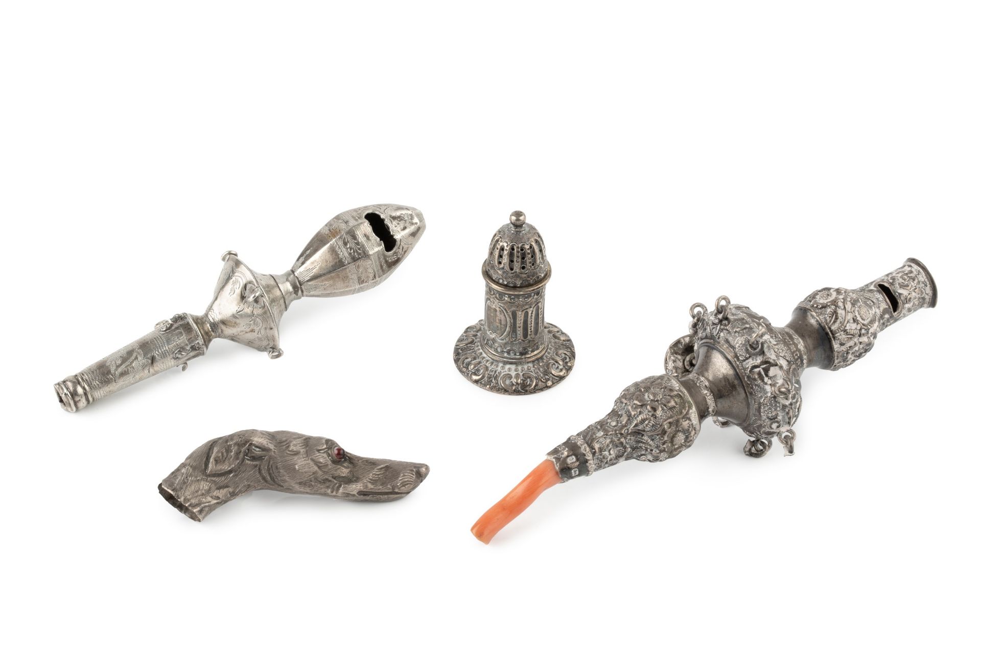 A late Victorian silver baby's rattle and whistle, with florally embossed decoration and coral