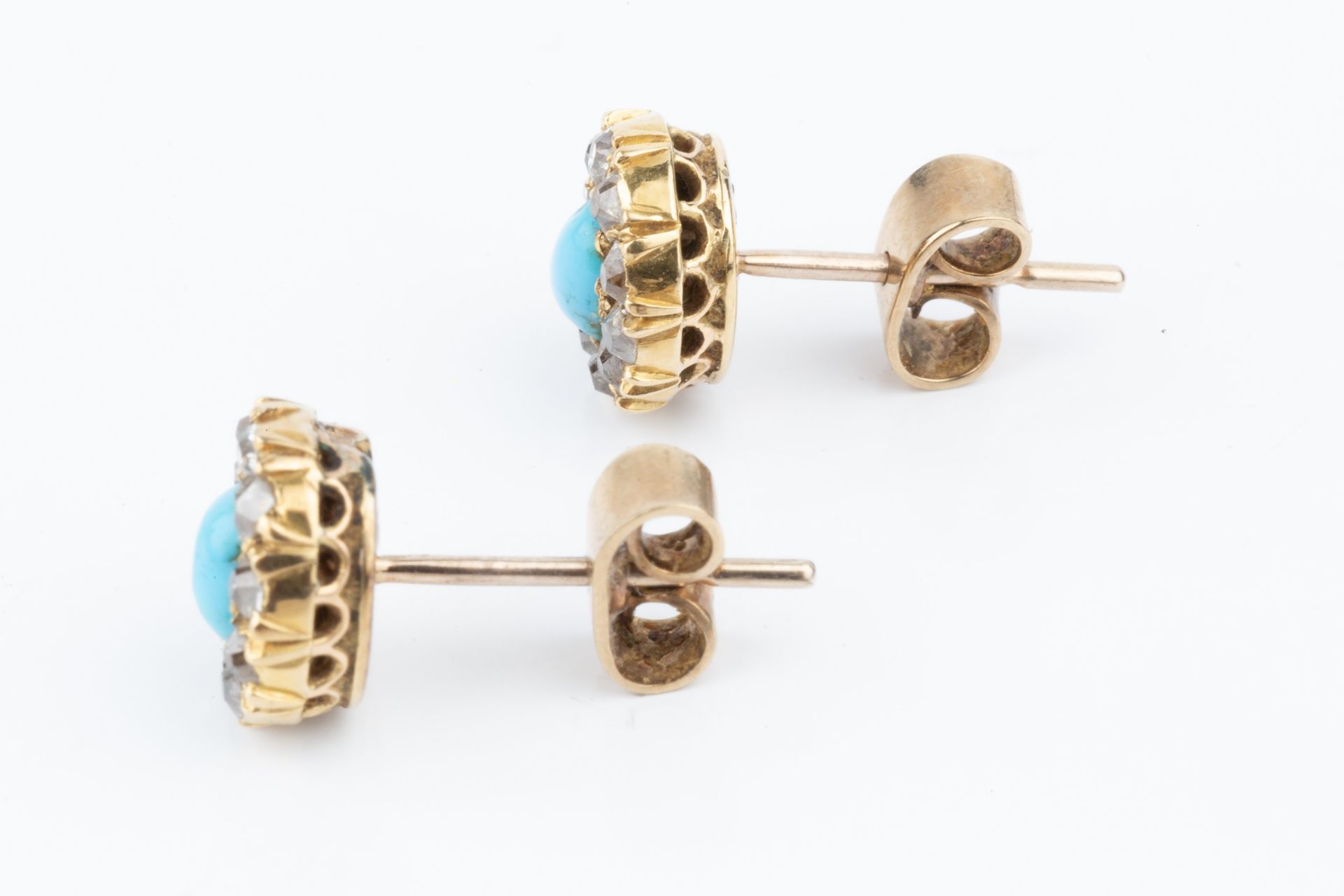 A pair of turquoise and diamond ear studs, each with central oval cabochon turquoise within a border - Image 2 of 5