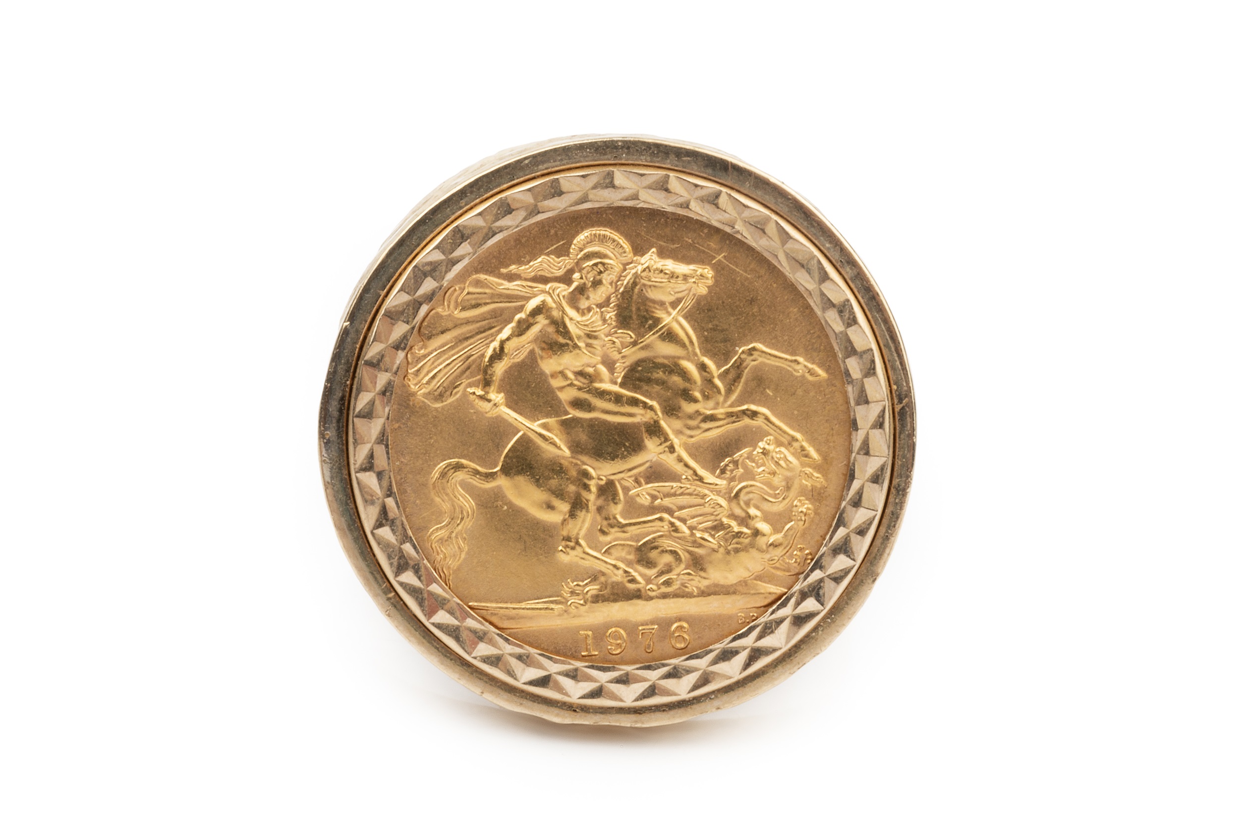 An Elizabeth II sovereign, 1976, in a 9ct gold clip mount ring with textured decoration