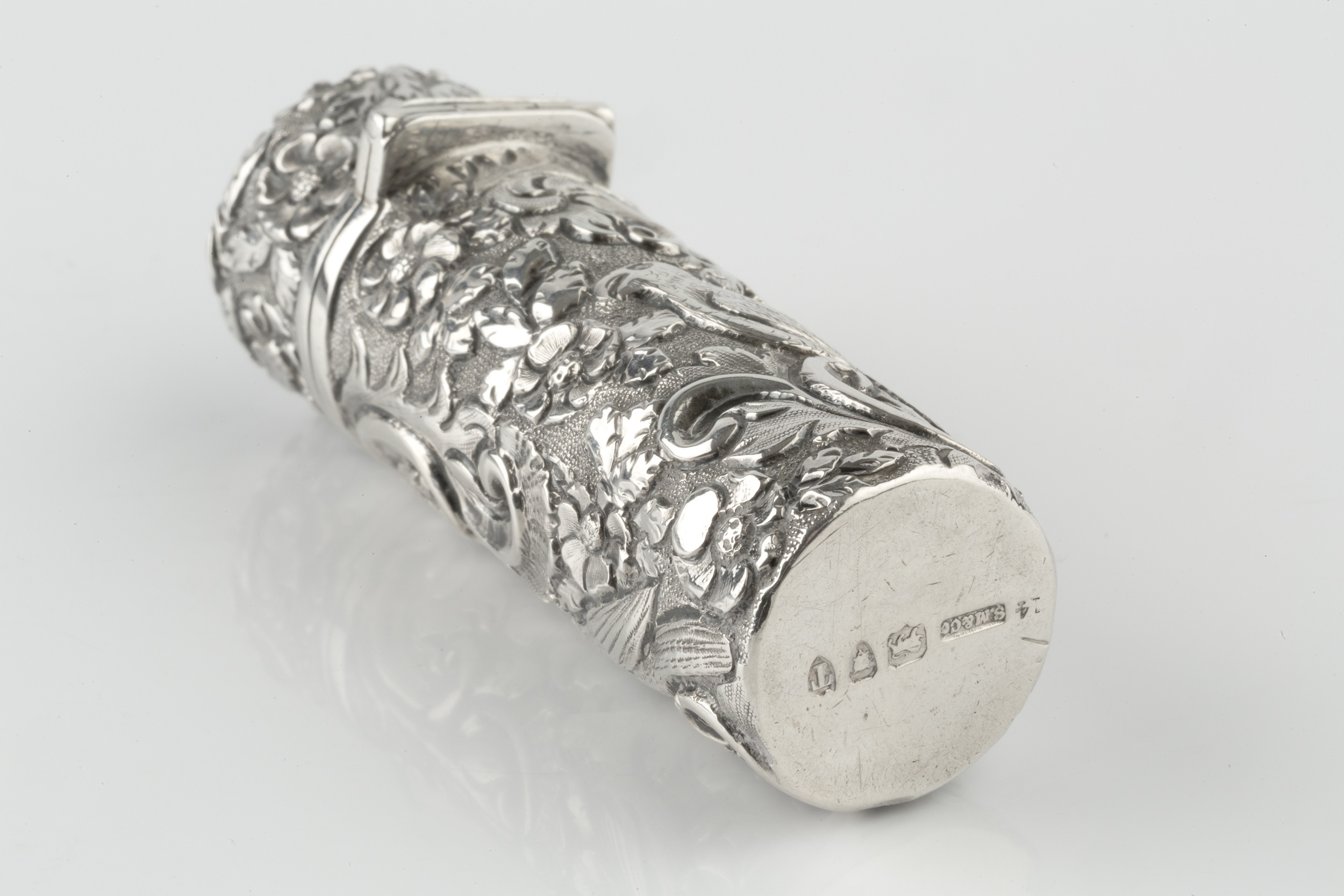 A late Victorian silver scent bottle of cylindrical form, embossed and engraved with exotic birds - Image 3 of 4
