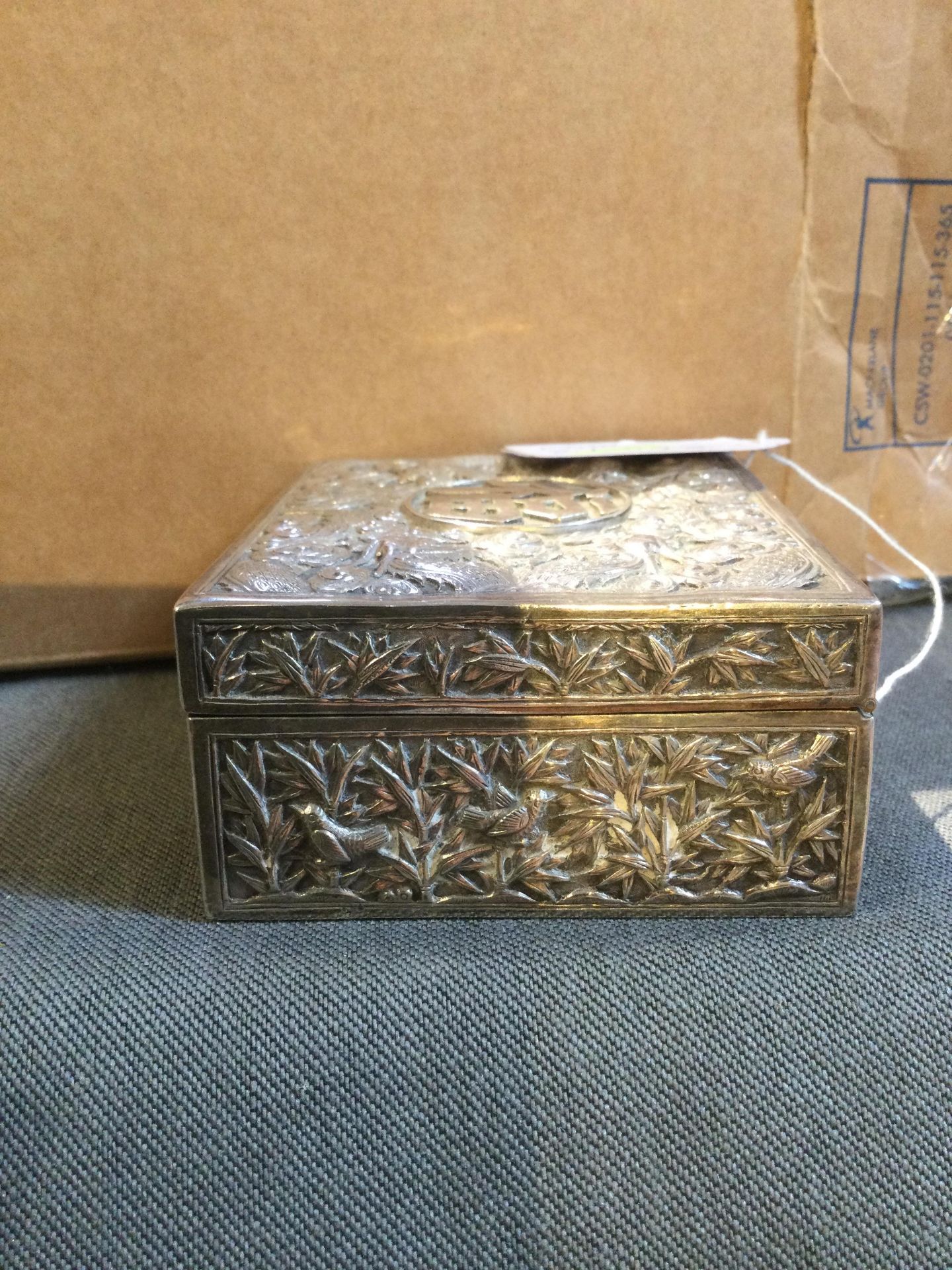 A Chinese silver rectangular box, with hinged cover, embossed and engraved with dragons amidst - Image 6 of 10