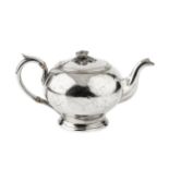 A mid 19th century American coin silver teapot, of globular form with flower cast finial, the handle