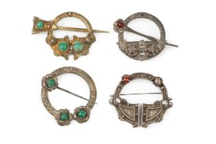 A Victorian Irish brooch, of Tara design, the fixed pin inset with a cabochon red stone, by West &