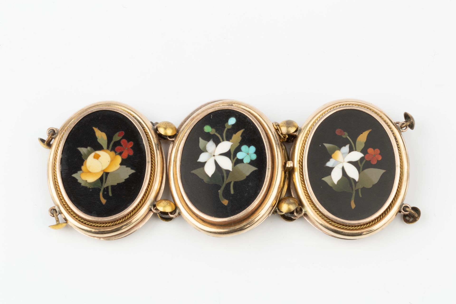 A pietra dura bracelet, the six oval panels inlaid with specimen floral sprays on a black ground, - Image 2 of 4