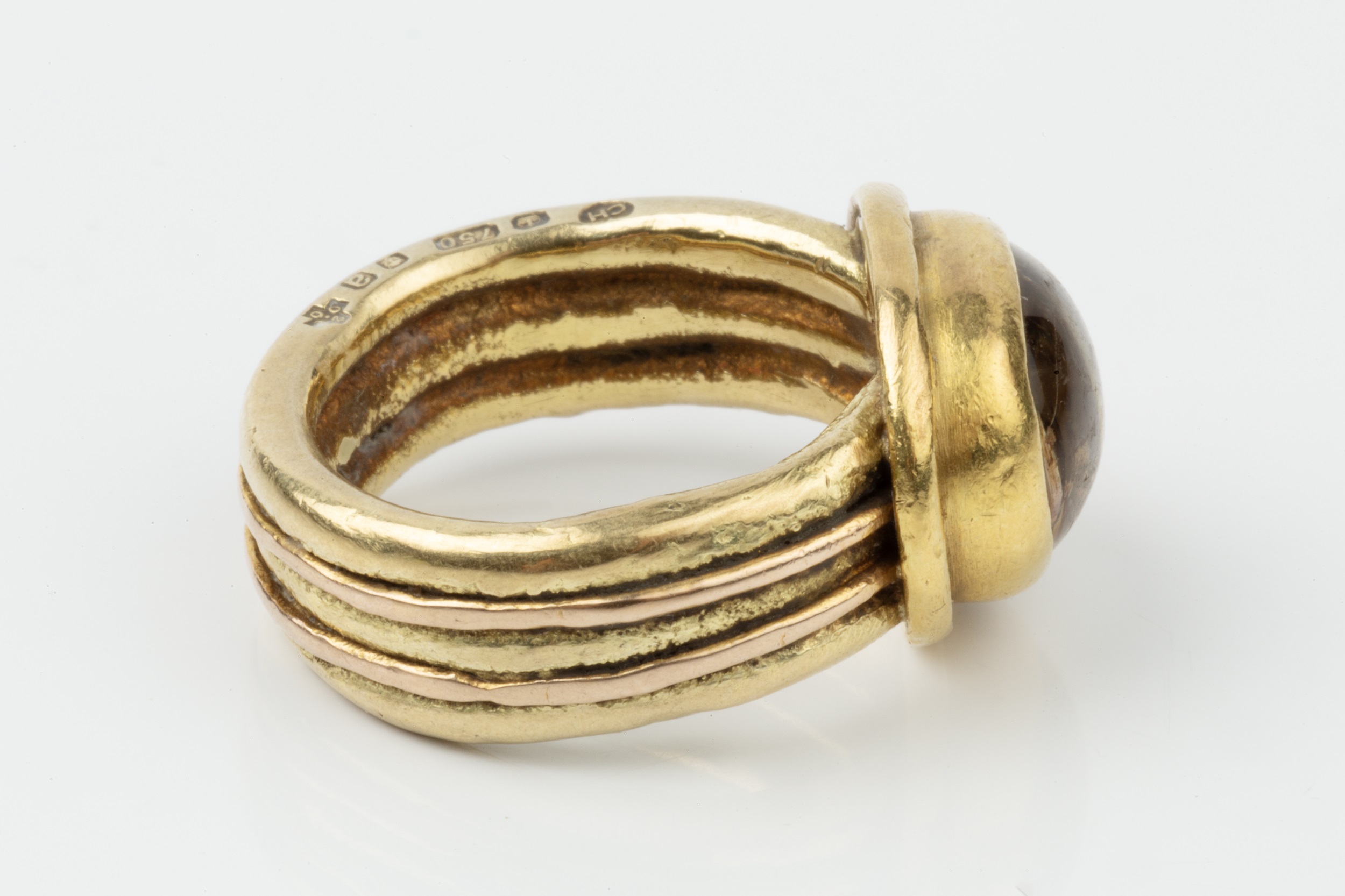 An 18ct gold and rutilated quartz set ring, the oval stone set in a heavy reeded setting and - Image 3 of 4