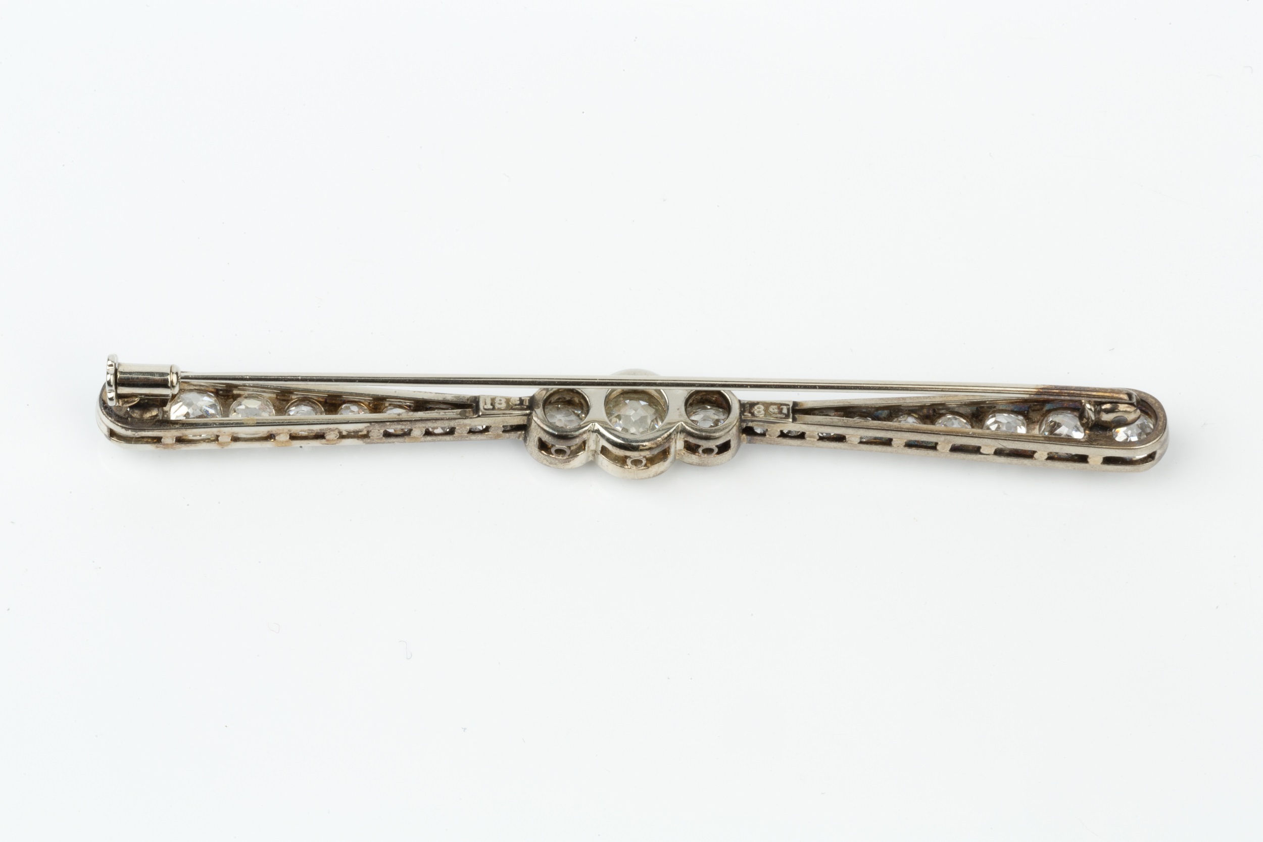 A diamond bar brooch, of tapered 'propellor' design, the three central graduated millegrain set - Image 2 of 2