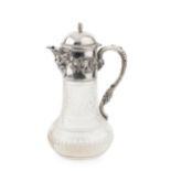 A Portuguese silver mounted cut glass claret jug, the hinged domed cover with barrel finial,