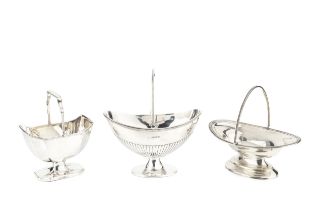 A George III silver swing handled sugar basket, of shaped rectangular design with reeded border,
