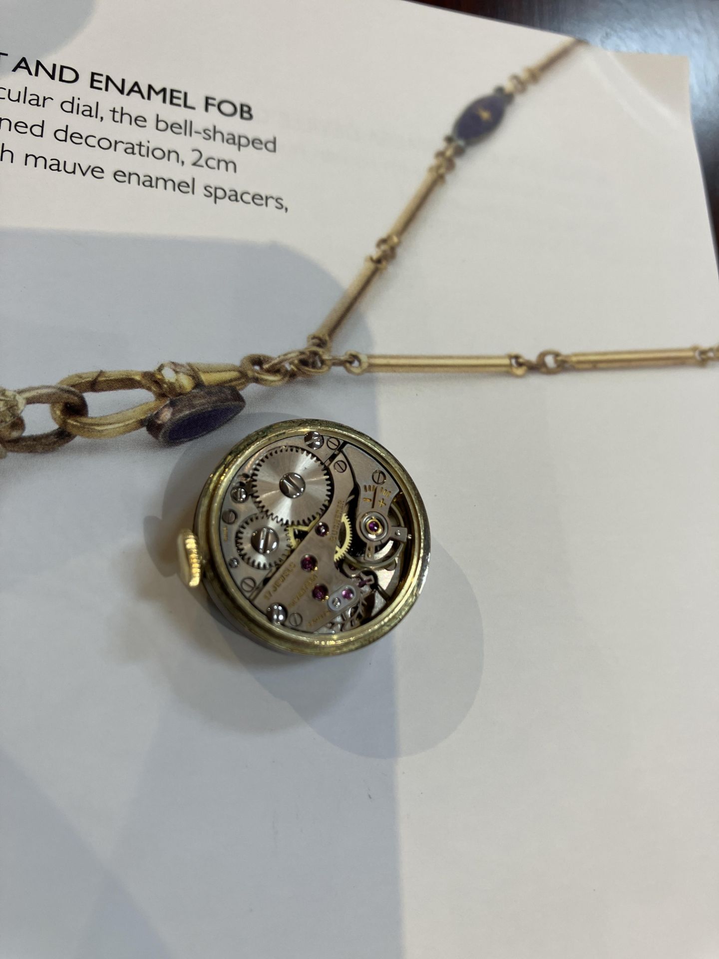 An early 20th century gilt and enamel fob watch by Bucherer, having circular dial, the bell-shaped - Bild 3 aus 3