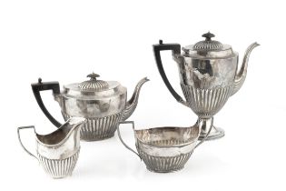 A late Victorian silver four piece tea and coffee service, of half lobed form, comprising teapot,