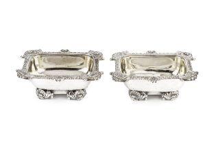 A pair of George III silver salts, of rectangular form, the shaped and gadrooned borders cast with