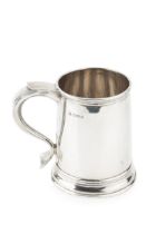 A George VI silver mug, of slightly bowed cylindrical form, with shaped scroll handle by Jay,