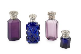 A 19th century Continental silver topped amethyst glass scent bottle, of faceted form, the hinged