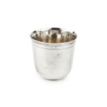 An 18th century French silver beaker, of plain form with a band of reeded decoration to the