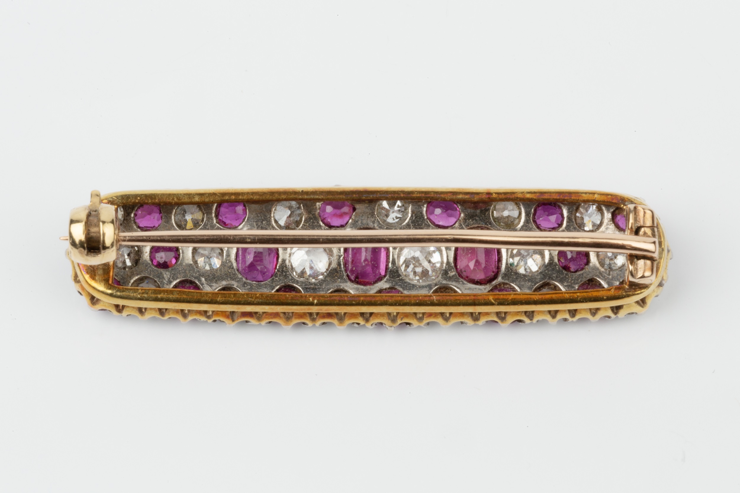 A ruby and diamond panel brooch, of slightly bowed and rounded rectangular design, set with three - Image 2 of 2