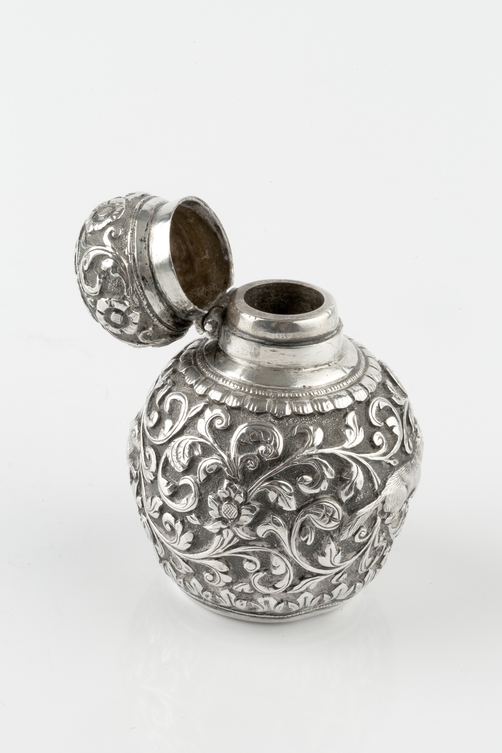 A late 19th century Anglo-Indian silver scent bottle, of globular form, embossed and engraved with a - Image 2 of 4