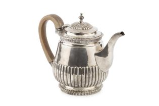 A mid Victorian silver bachelor's teapot, with gadrooned borders and part lobed decoration, having