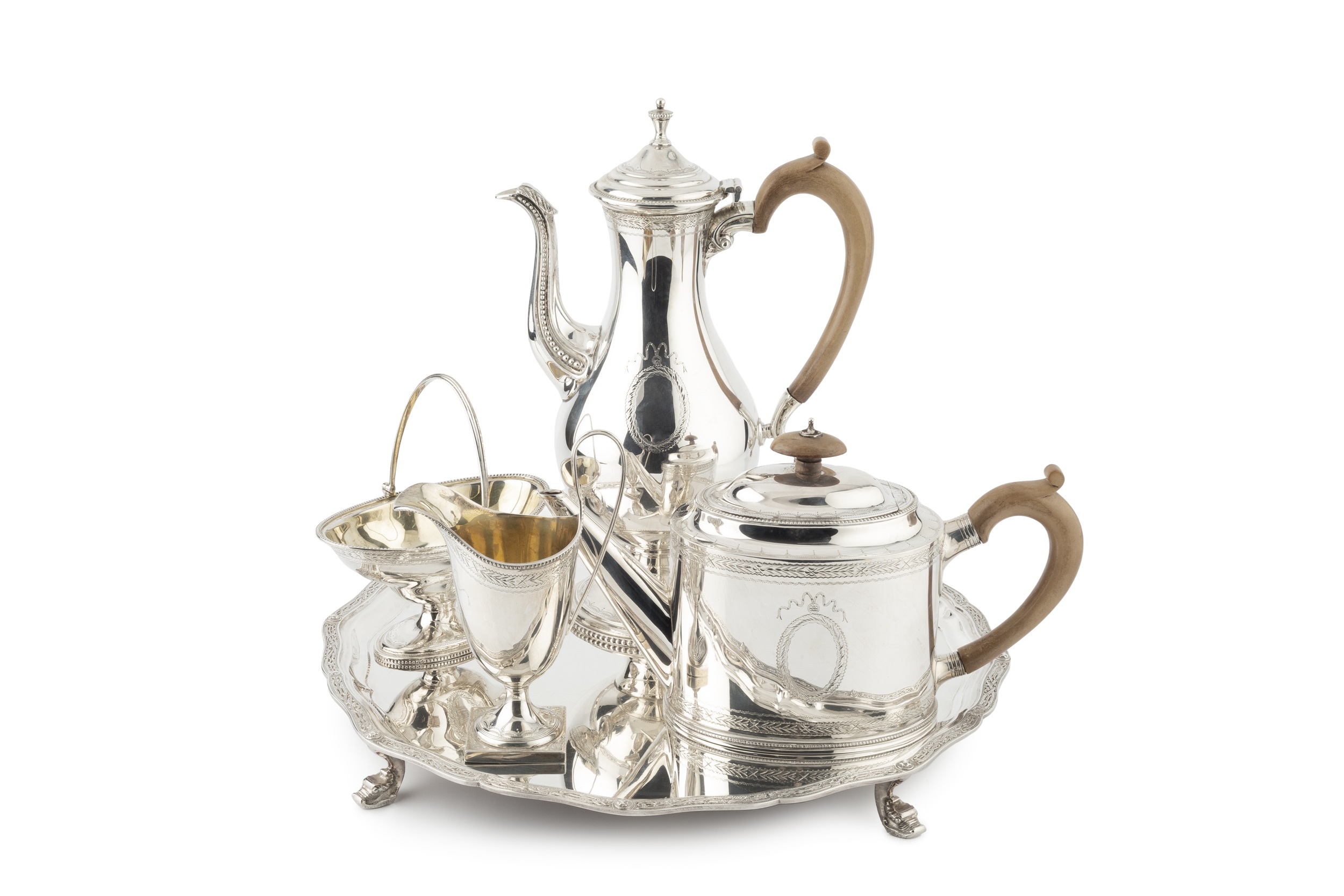 A silver four piece tea and coffee service, with tray, after a design by Hester Bateman,