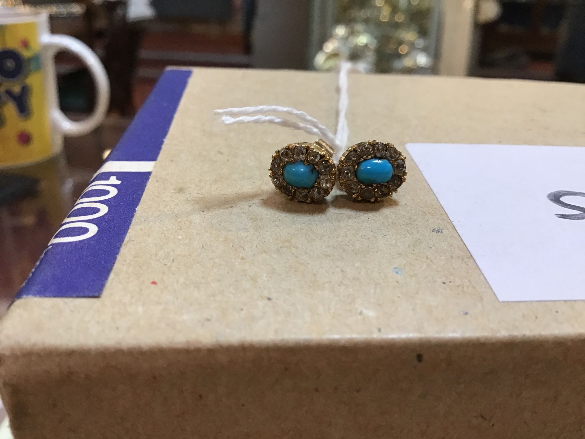 A pair of turquoise and diamond ear studs, each with central oval cabochon turquoise within a border - Image 4 of 5