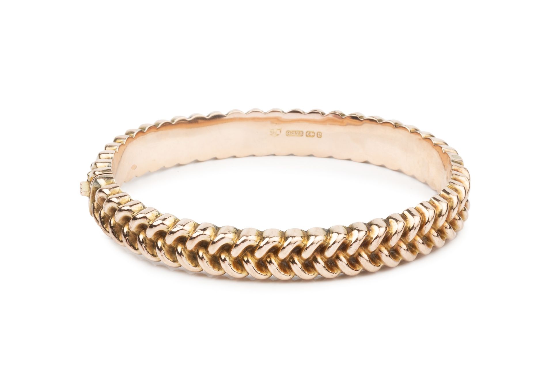 A Victorian 9ct rose gold hinged bangle, with an embossed bead and weave design, hallmarked for