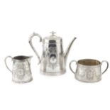 A mid Victorian silver teapot and matching sucrier, of oval tapering form, engraved with swags of