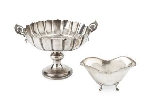 A late Victorian silver pedestal bowl, of shaped and fluted form, with foliate scroll twin