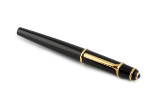 A Cartier ball point pen, in black with blue resin cabochon mounted lid, no. 106104, 14cm long