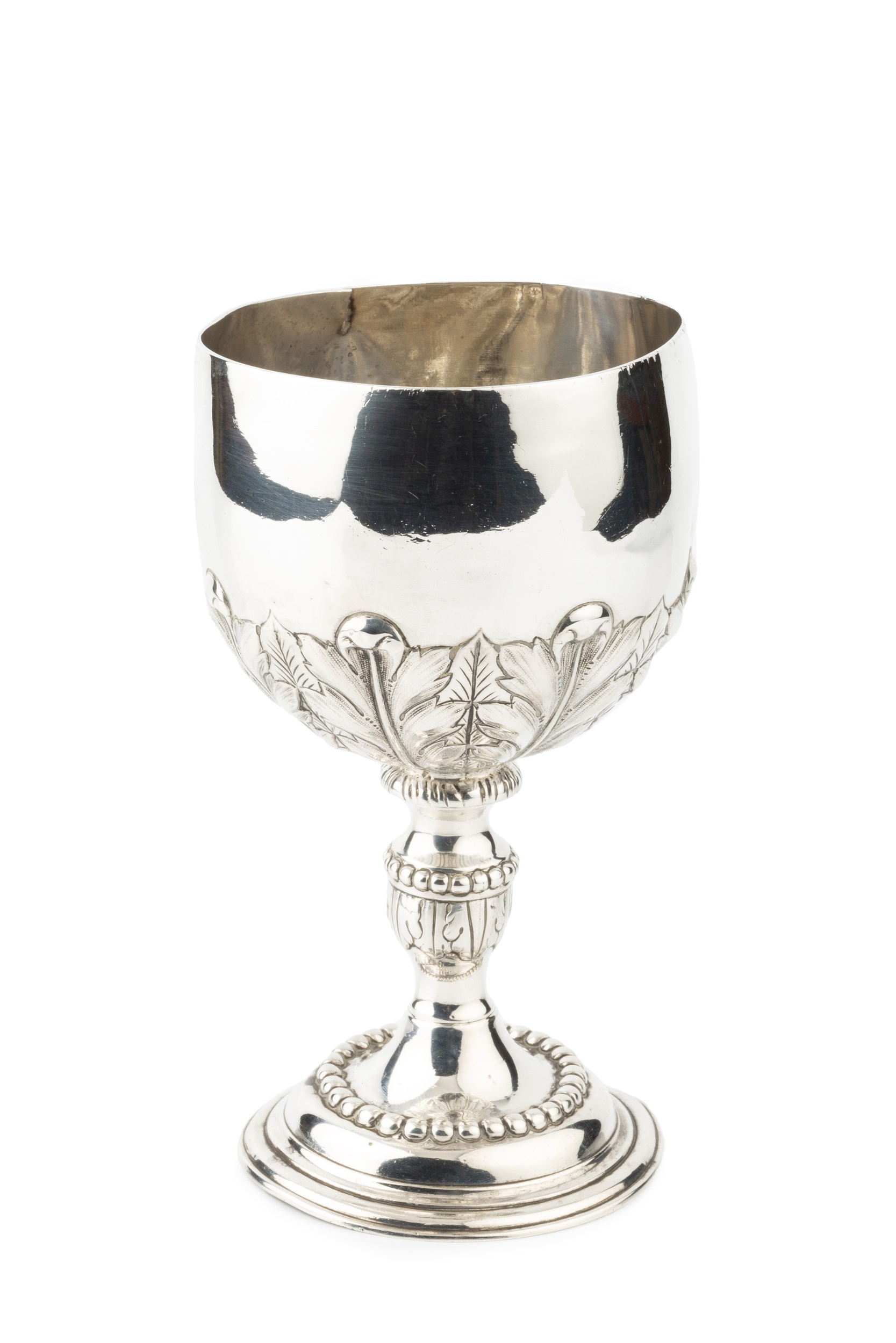 A George III silver goblet, the bowl chased and engraved with stylised leaves, on knopped stem and