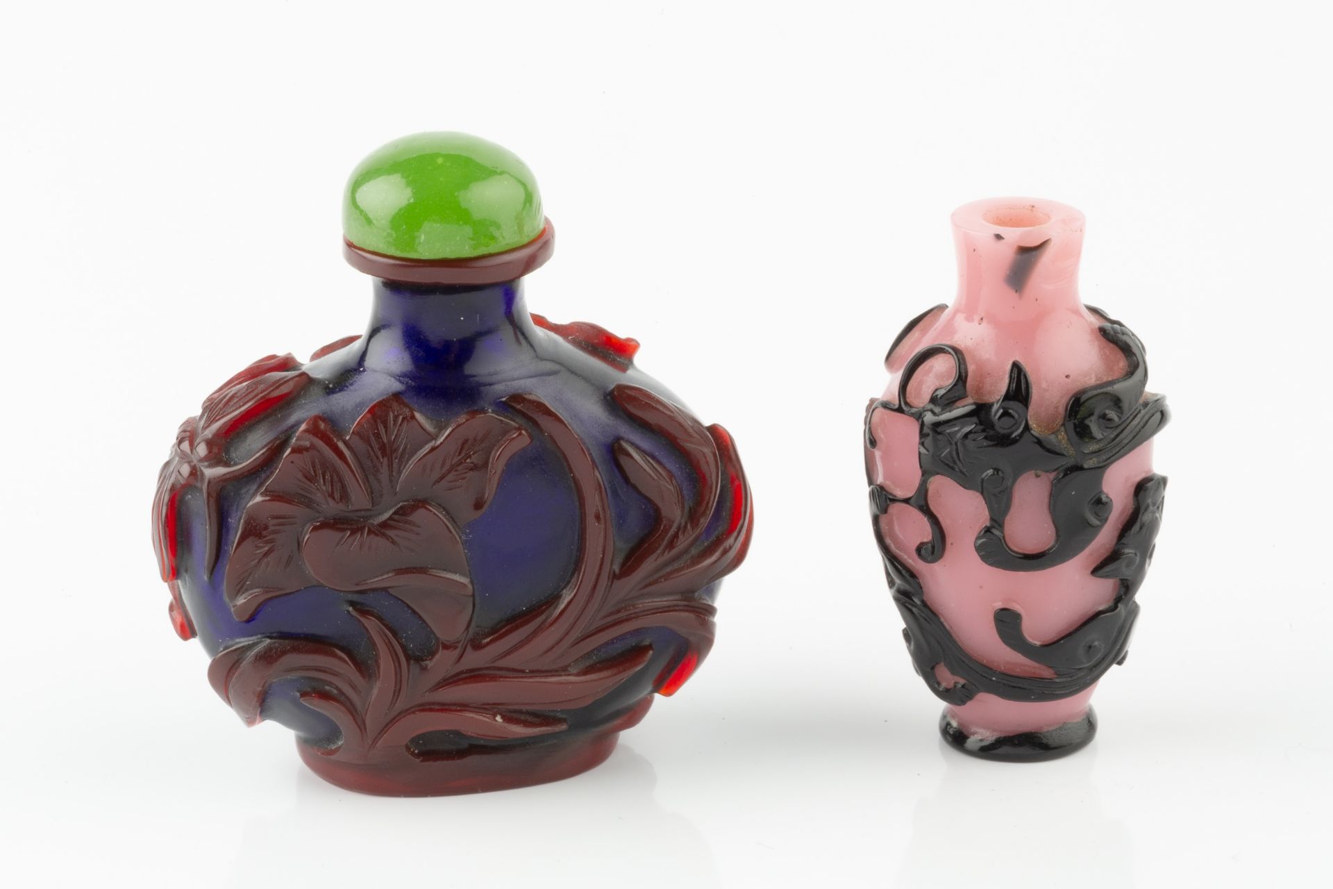 A Chinese red overlaid blue 'Peking' glass scent bottle, relief carved with flowering foliage and - Image 2 of 11