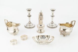 A collection of silver, comprising a George III half-lobed milk jug, London 1809, another milk