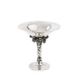 A silver small tazza, by Georg Jensen, with dished and planished top on wrythen support with