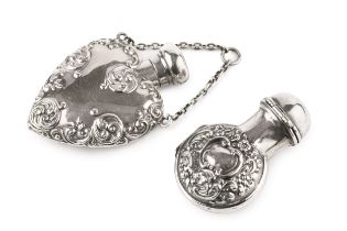 A late Victorian silver scent bottle case, of hinged opening form, embossed with flowers and c-