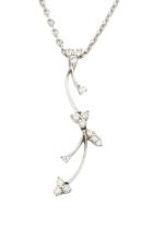 An 18ct white gold and diamond pendant, of foliate design, set with clusters of small brilliant