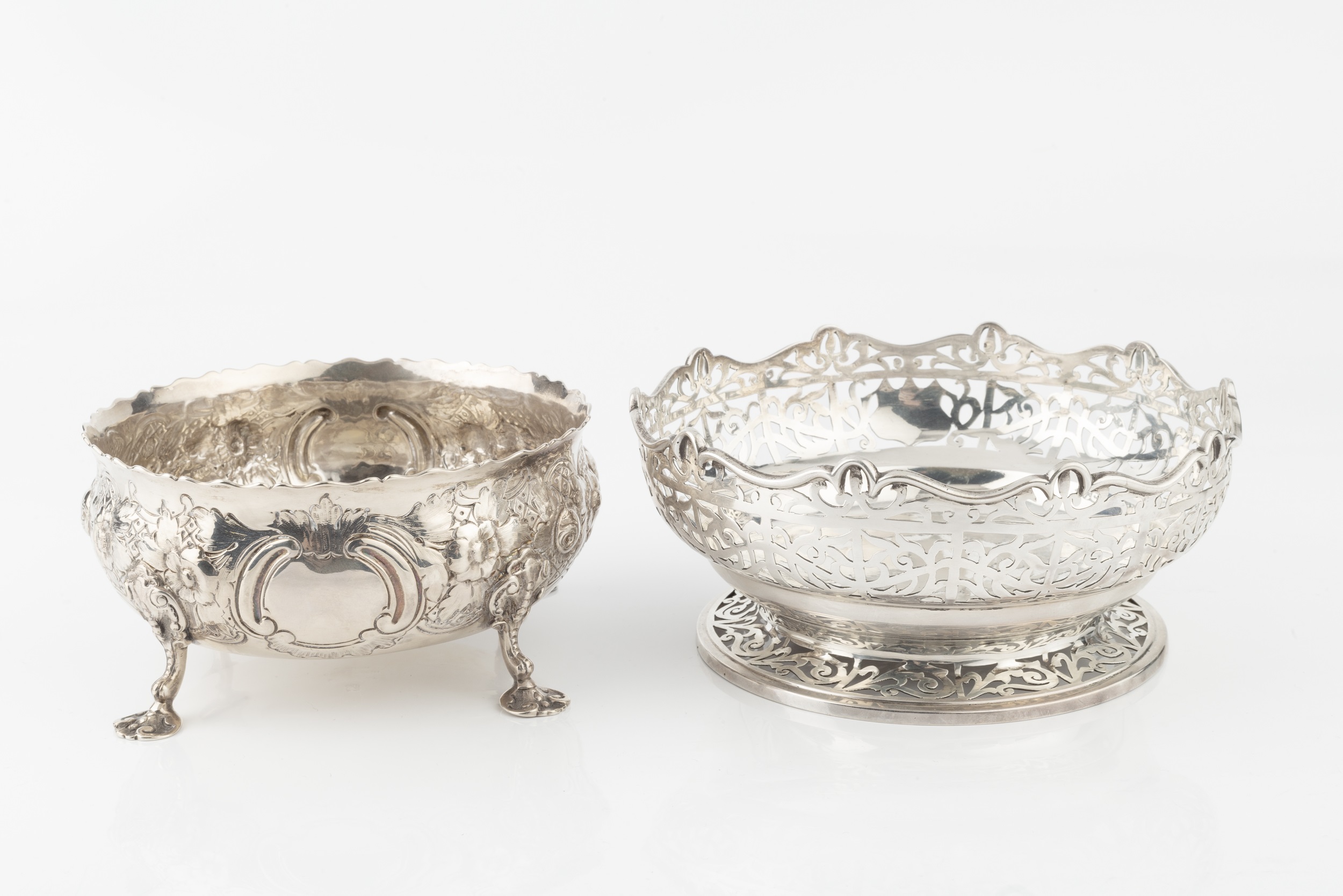 A late Victorian silver bowl, embossed and engraved with flowering foliage, on shaped legs with lily - Image 3 of 3