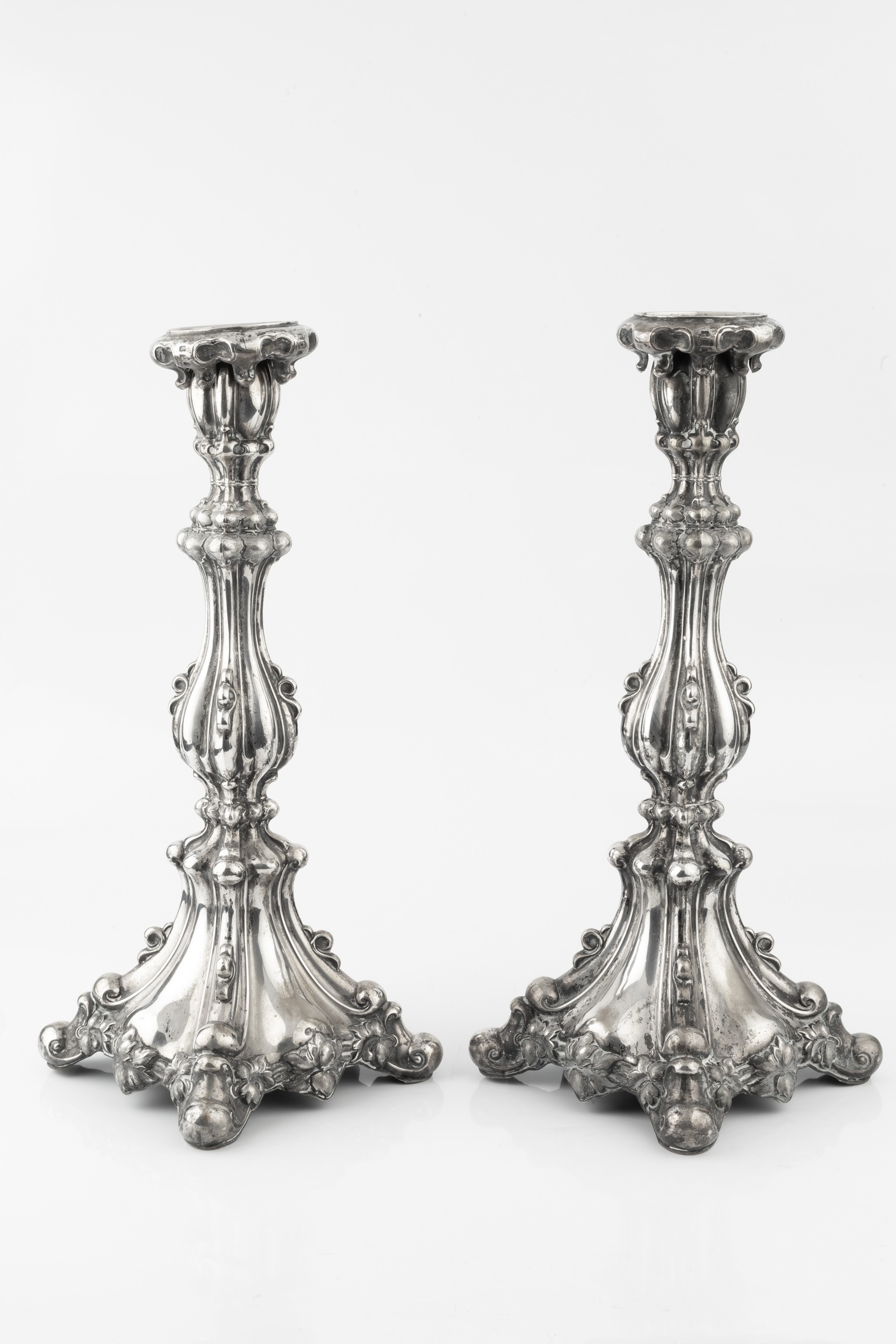 A pair of 19th century German silver candlesticks, of knopped and lobed form, with embossed - Image 2 of 2