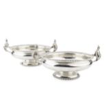 A pair of George V silver twin handled serving dishes, of circular form with gadrooned borders,