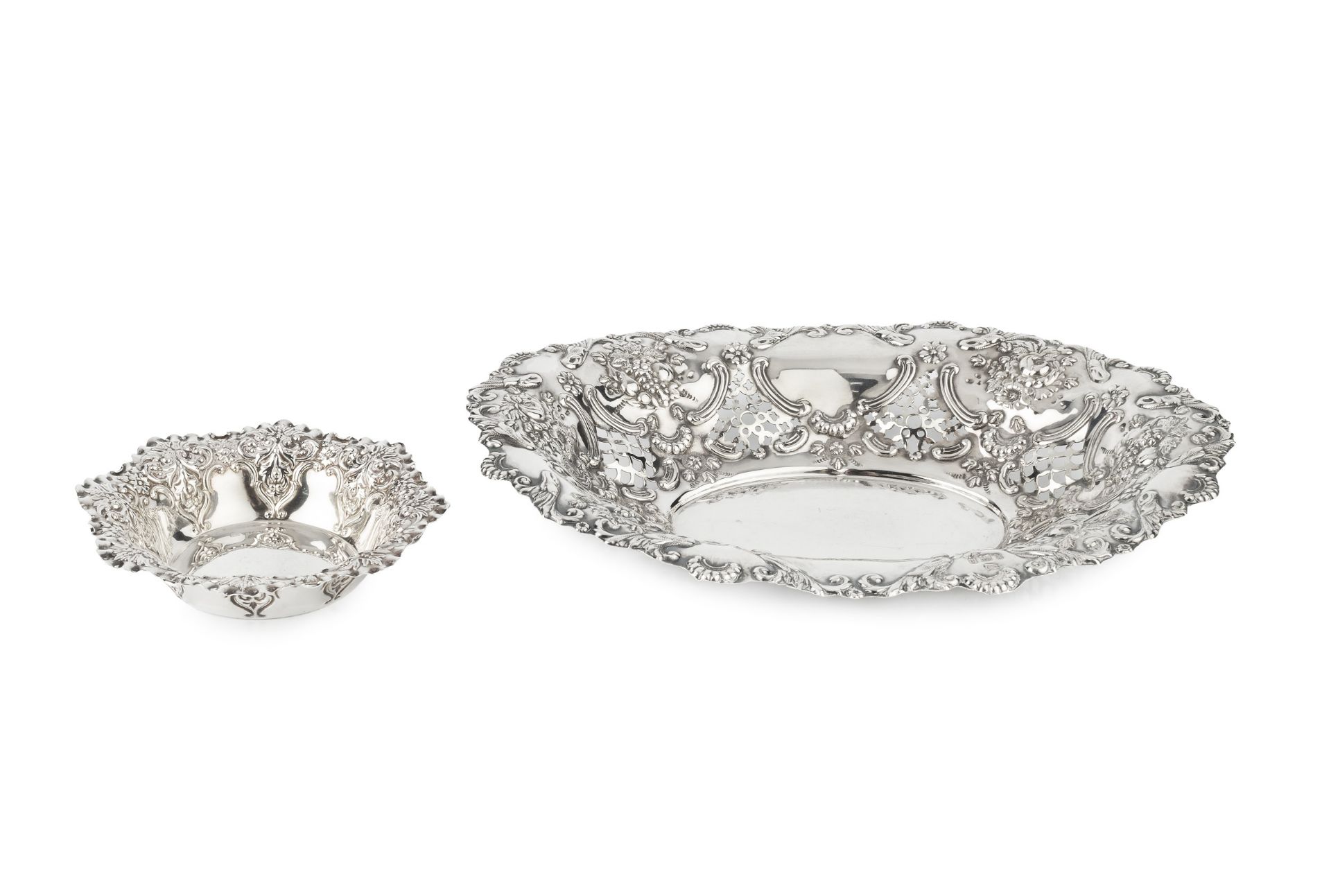 A late Victorian silver oval dish, pierced and repoussé decorated with fruit, flowers and c