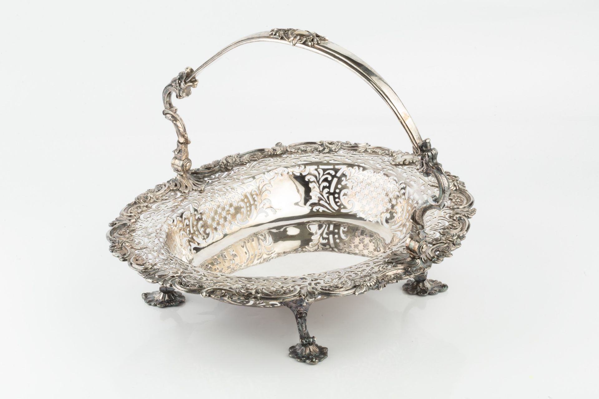 A George II silver oval basket, the shaped border cast with flowering foliage and scrolls and having - Image 3 of 3