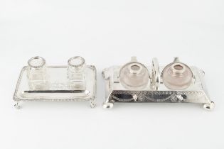 A George V silver rectangular inkstand, with gadrooned border, foliate cast corners and fitted