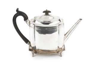 A George III silver teapot on stand, of shaped outline, engraved with wrigglework borders and having