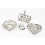 A late Victorian silver seven bar toast rack, of shaped outline, by Dixon & Sons, Sheffield 1897,